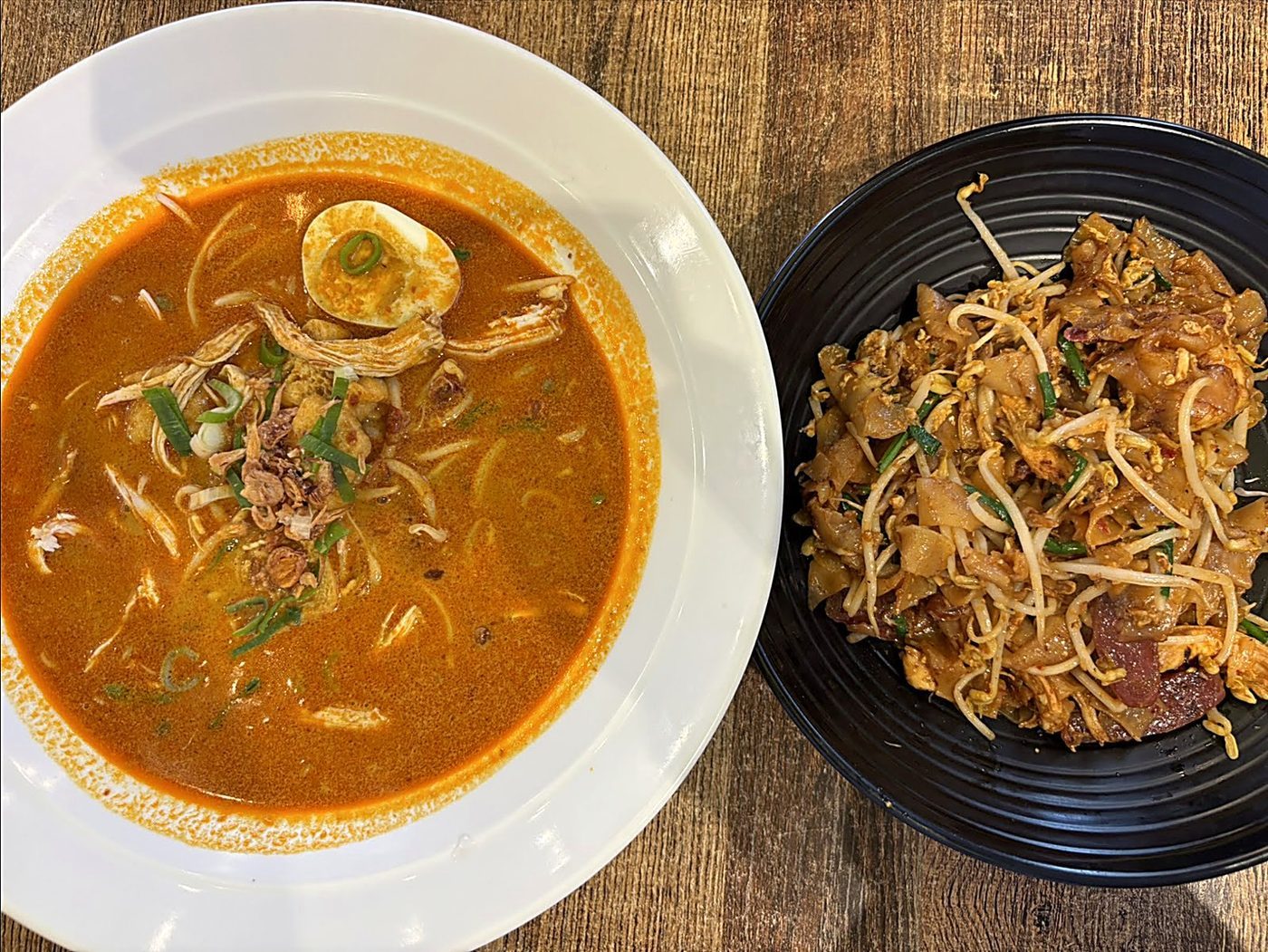 Iconic Curry Laksa with Rich Coconut Broth and Char Kway Teow